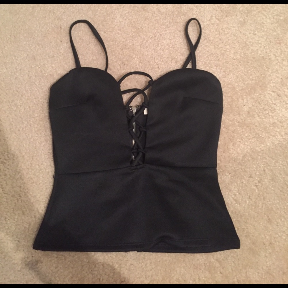 Black crop top. Crisscrossed front.