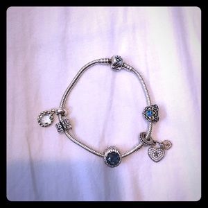 Pandora Bracelet with four charms and a spacer
