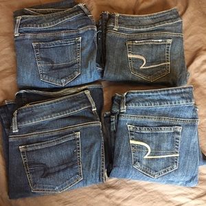 FOUR PAIRS OF AMERICAN EAGLE JEANS