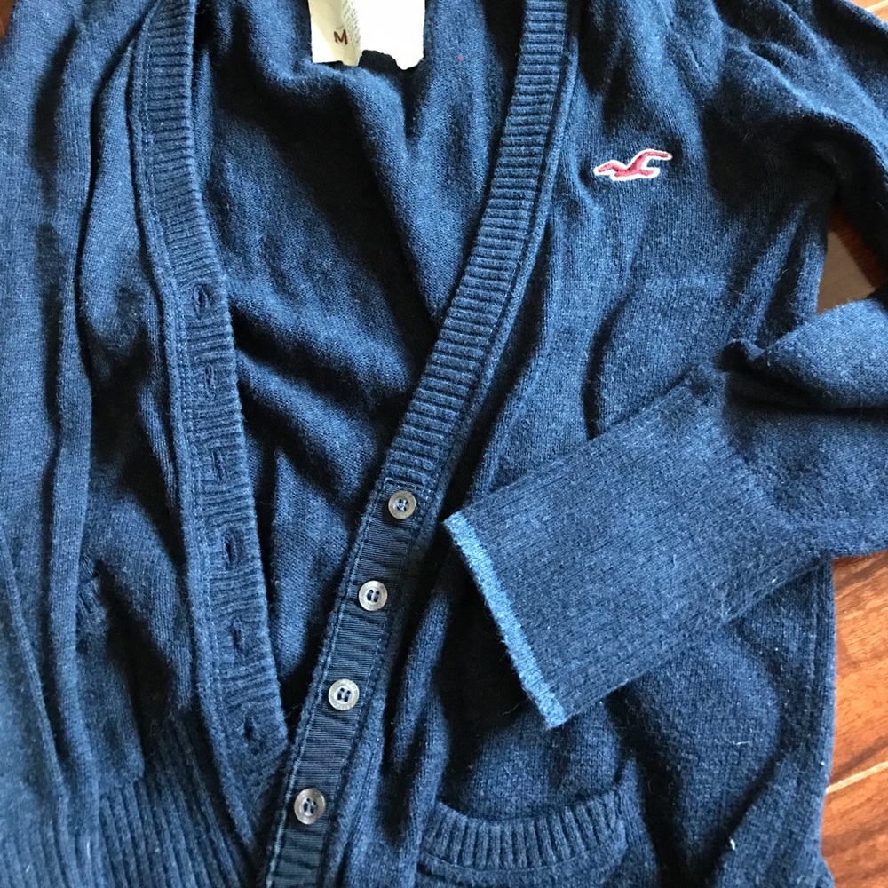 Button up three quarter sleeve cardigan.