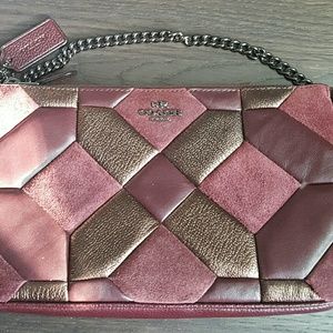 NWT Coach Nolita wristlet in mix of leathers