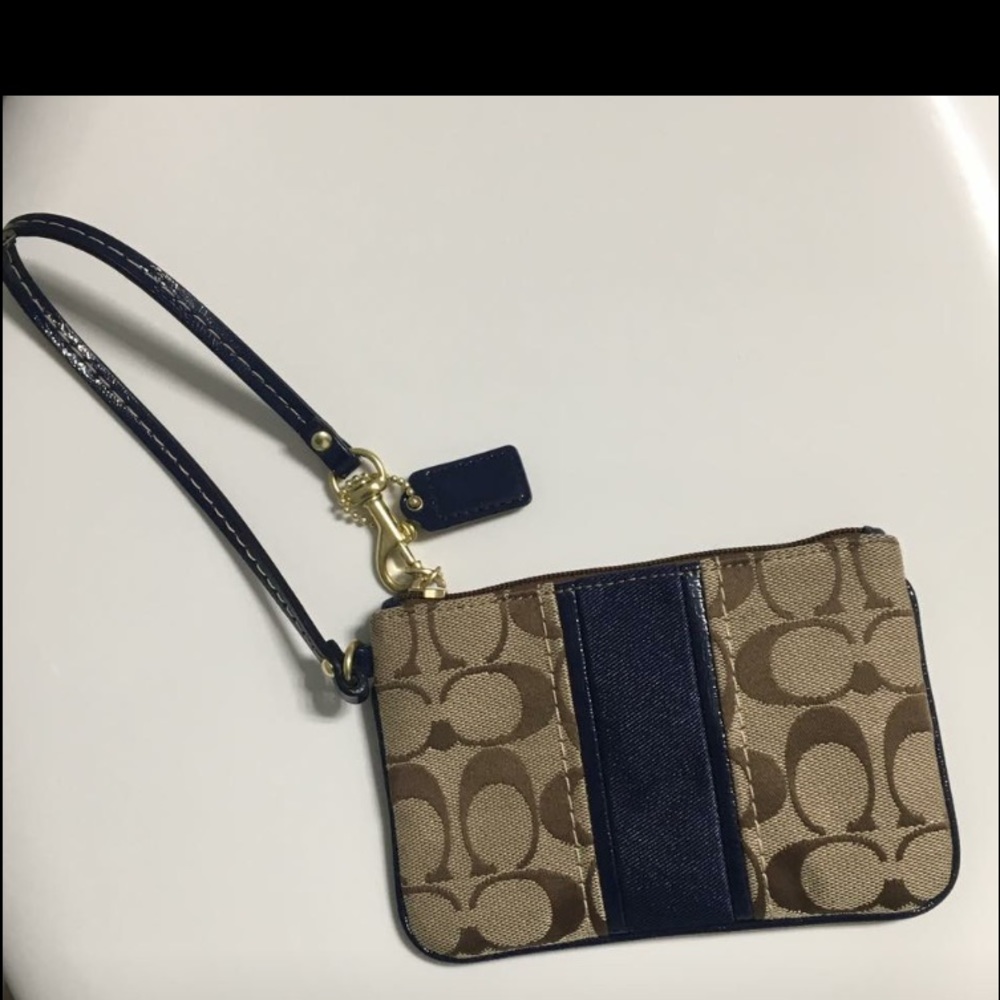 Coach Signature Wristlet.