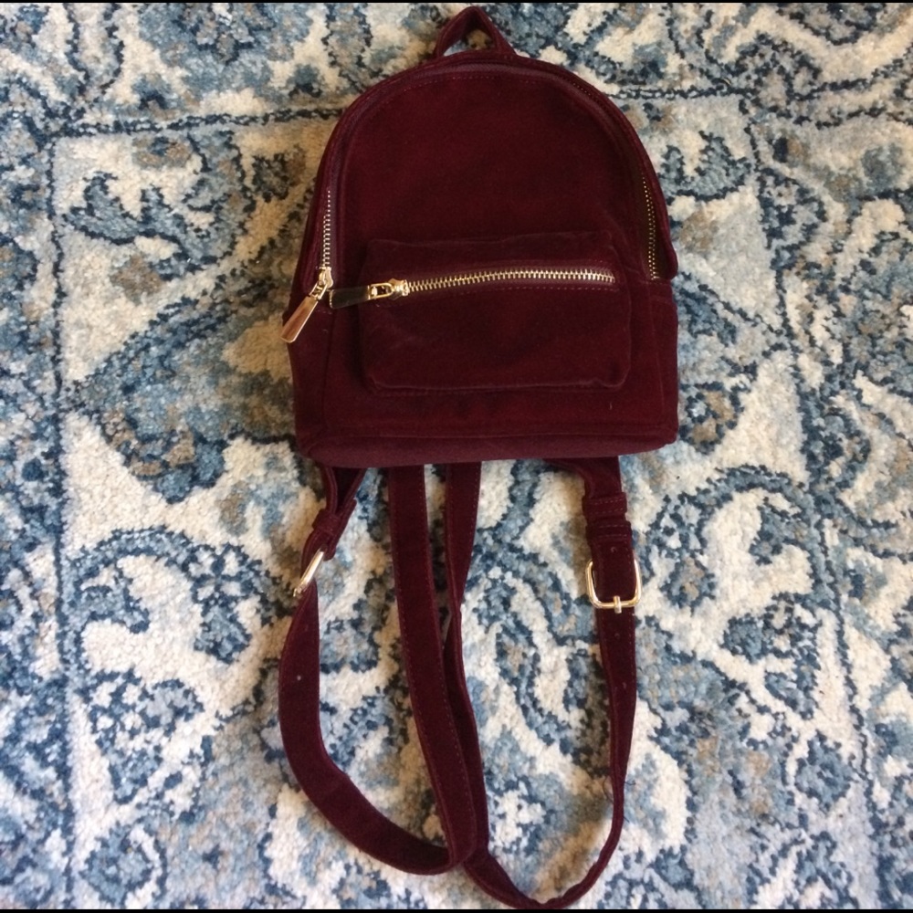 Mini dark red velvet backpack