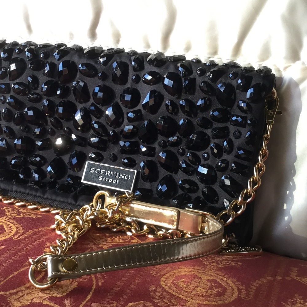 Sequined evening leather bag.