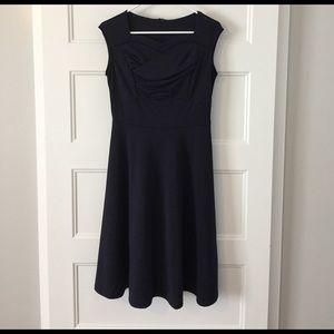 Navy sweetheart neckline dress.