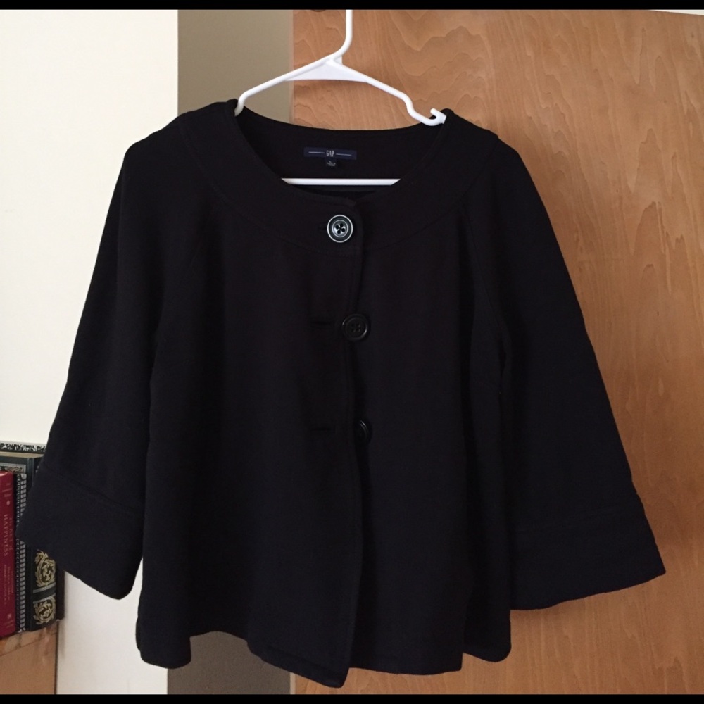 Black oversize poncho cardigan.