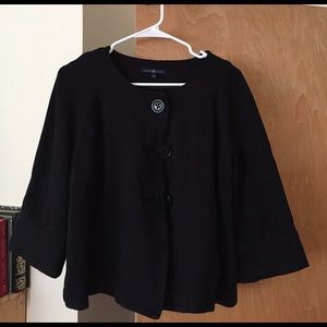 Black oversize poncho cardigan.