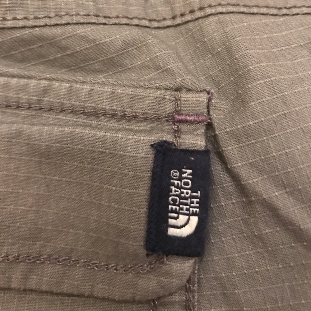 Olive colored The North Face shorts as new