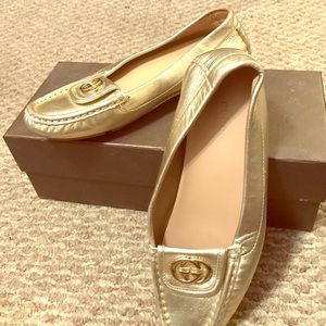 Gold Gucci loafers