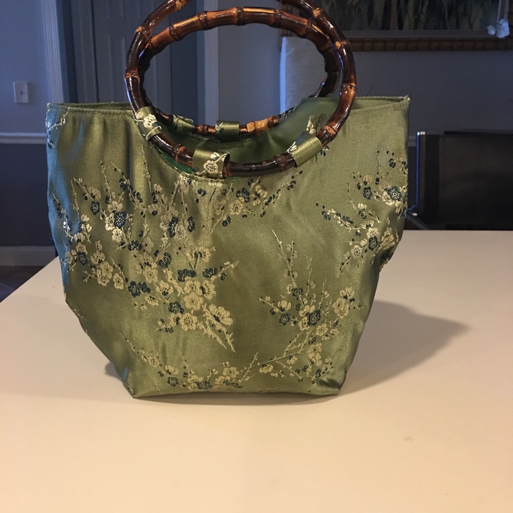 Green silk handbag with bamboo handles