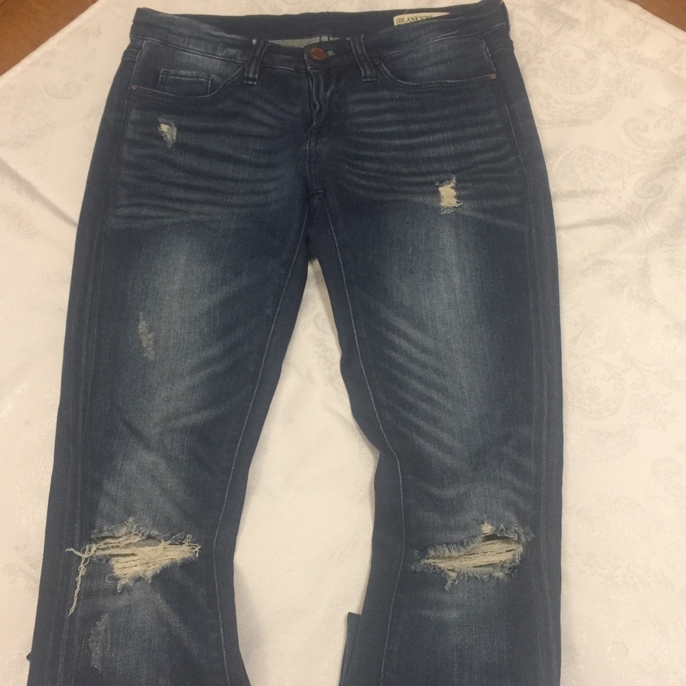 Distressed dark wash jeans by Blank NYC