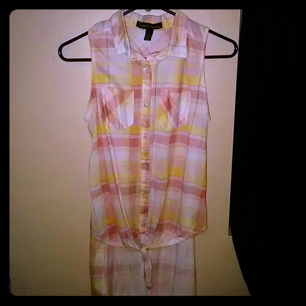 Light colors, tail, no sleeves, has all buttons