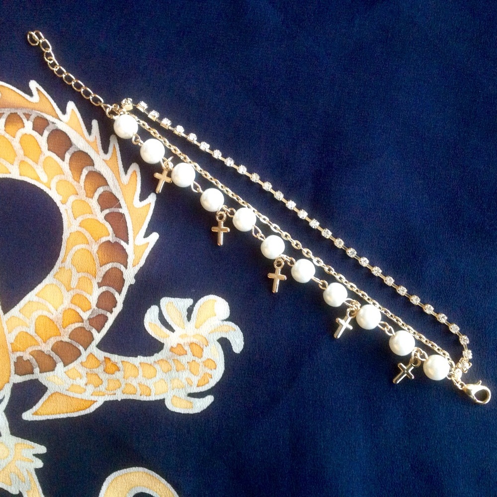 Gold metal bracelet with cross charms, pearls