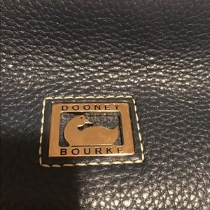 Medium sized Dooney & bourke leather purse.