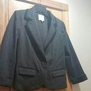 Dark grey blazer with black trim