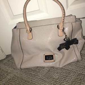 A purse from guess with matching wallet