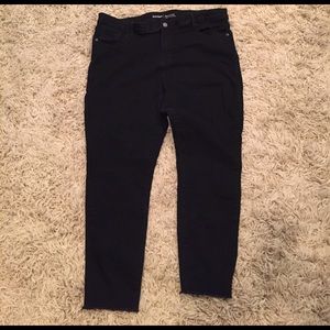 Black jeans with frayed bottoms purchased likethat