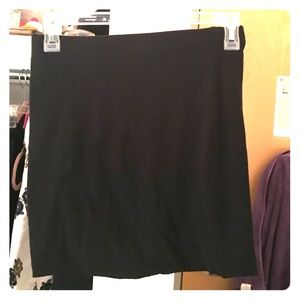 Hip hugging black skirt