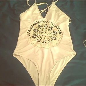 Beautiful white & crocheted backless bathing suit.