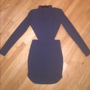 Long sleeved, open back dress