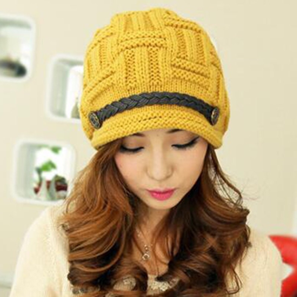 Yellow gold knit hat with braided leather