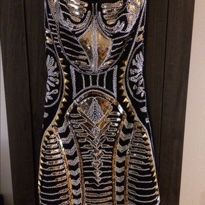 Short back beaded strapless dress.