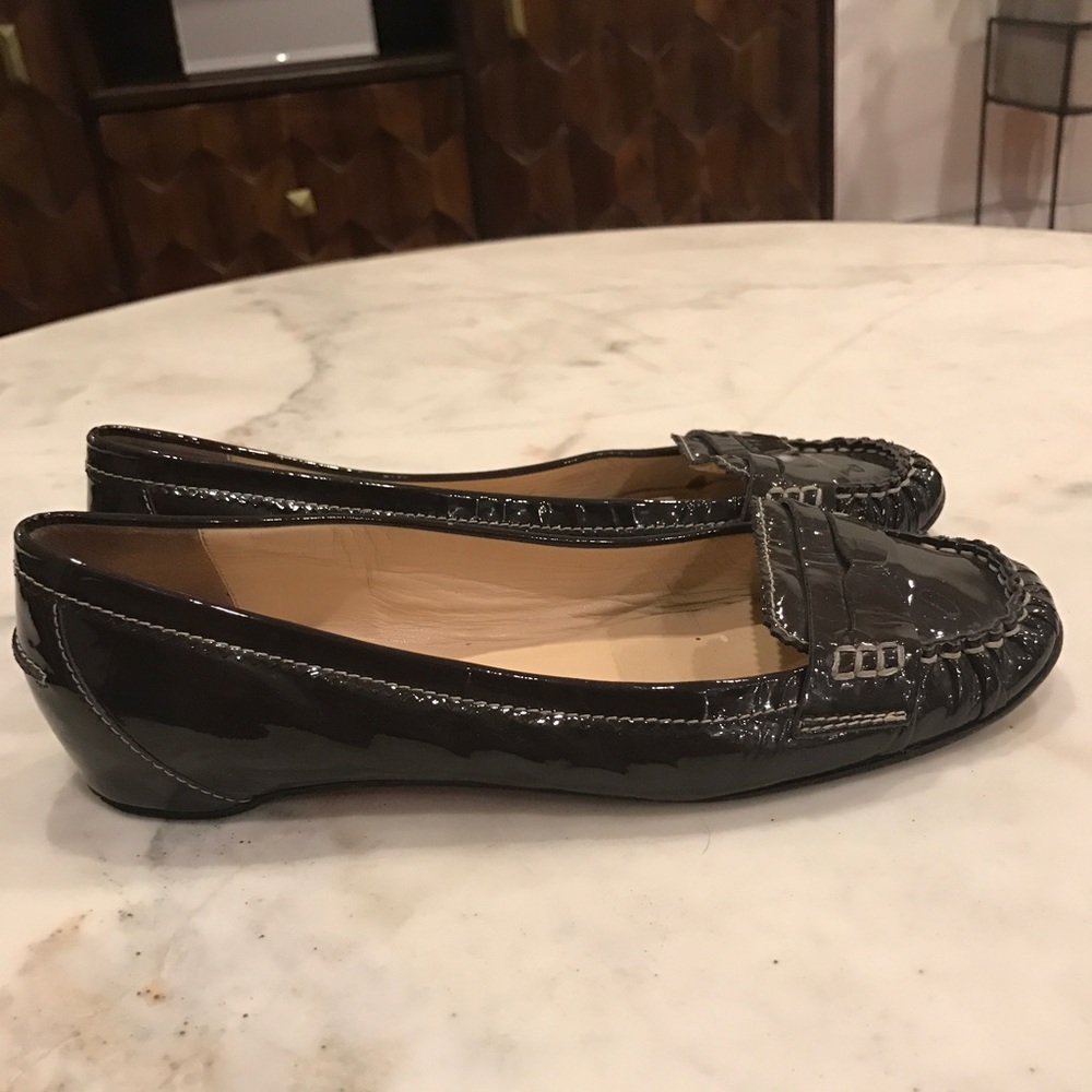Christian Loubutin patent leather penny loafer.
