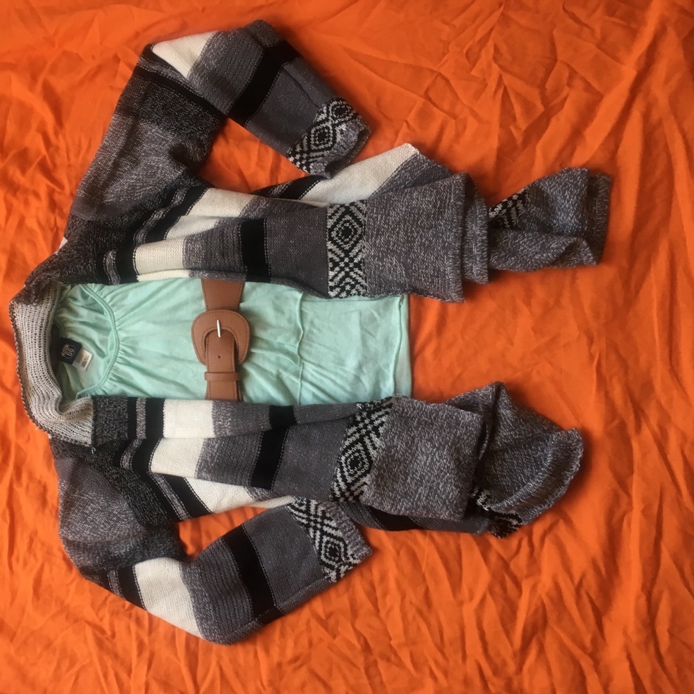 Girl's sweater, top, and belt.
