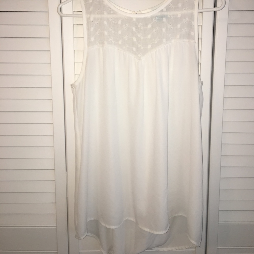 White button in the back tank top.