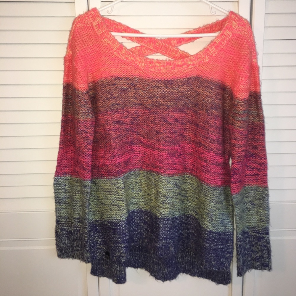 Colorful sweater. Criss cross back.