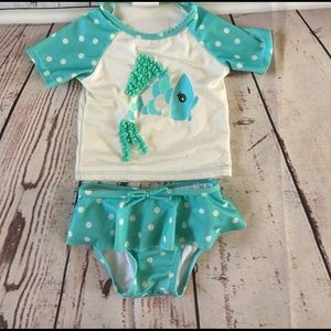 Rash guard shirt and skirt bathing suit.