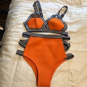 Orange bikini with black and white striped straps