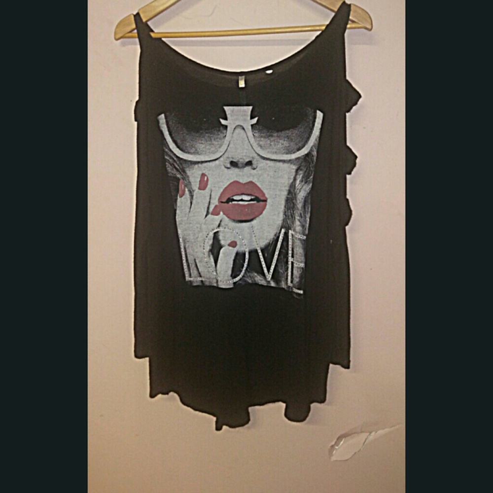 Black top with long sleeves.