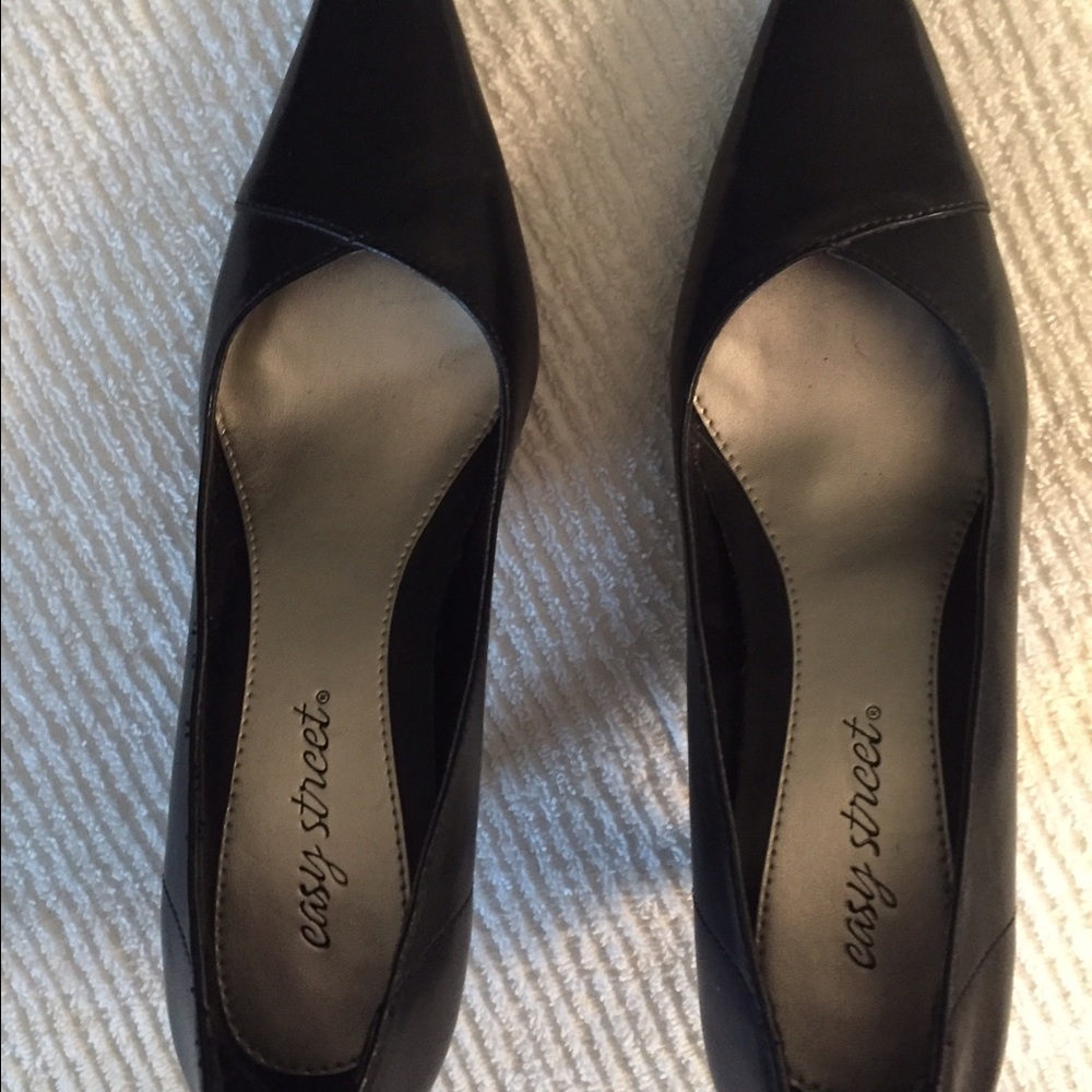 Black leather pumps