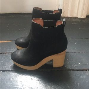 Black leather with wooden heel boots.