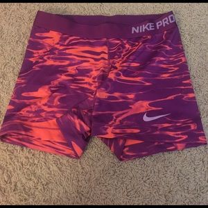 Adult large purple and coral Nike Pros