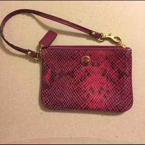 Dark magenta snake skin coach wristlet