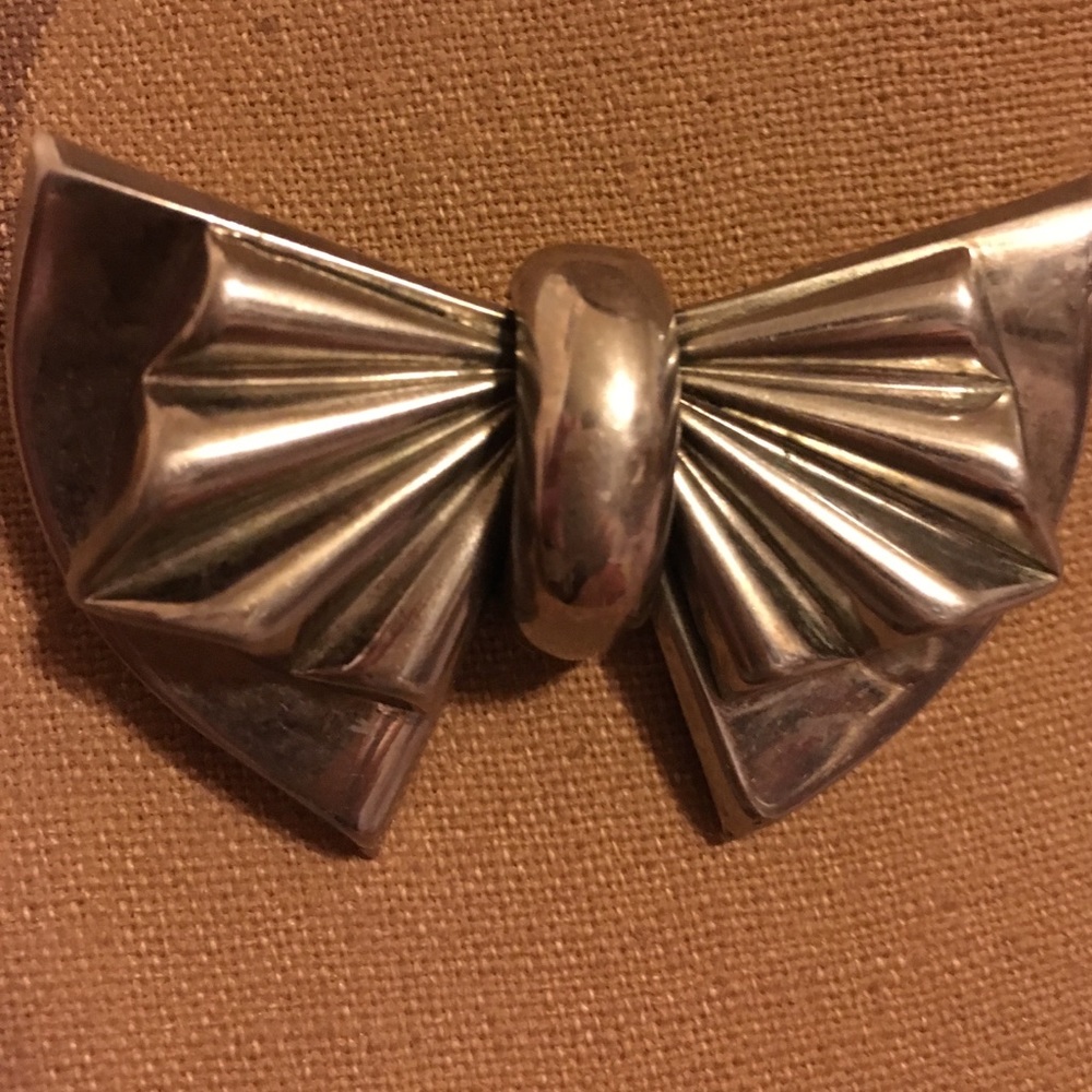 Silver tone bow brooch
