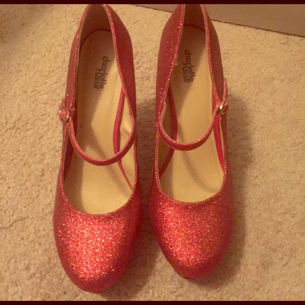 Red high heeled glitter pumps