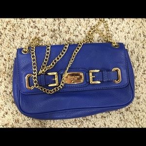 Blue Michael Kors bag with gold chain strap