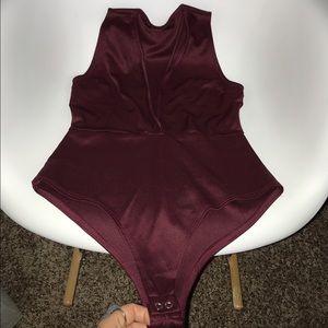 Deep neck line body suit.