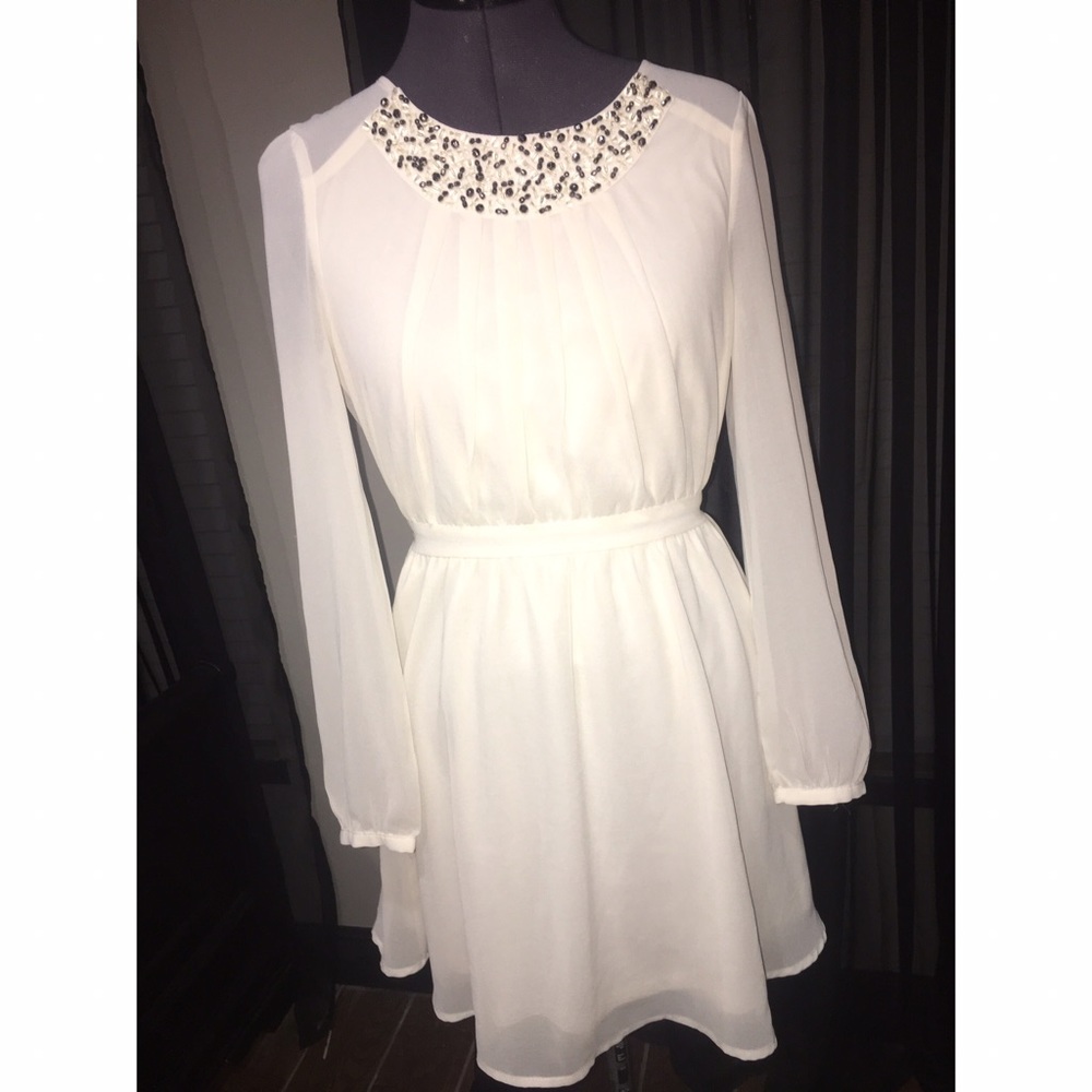 Cream-ish loose dress, gathers at the waist