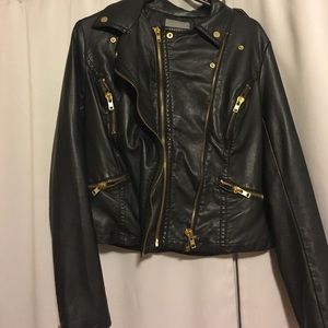 Leather jacket with gold zippers