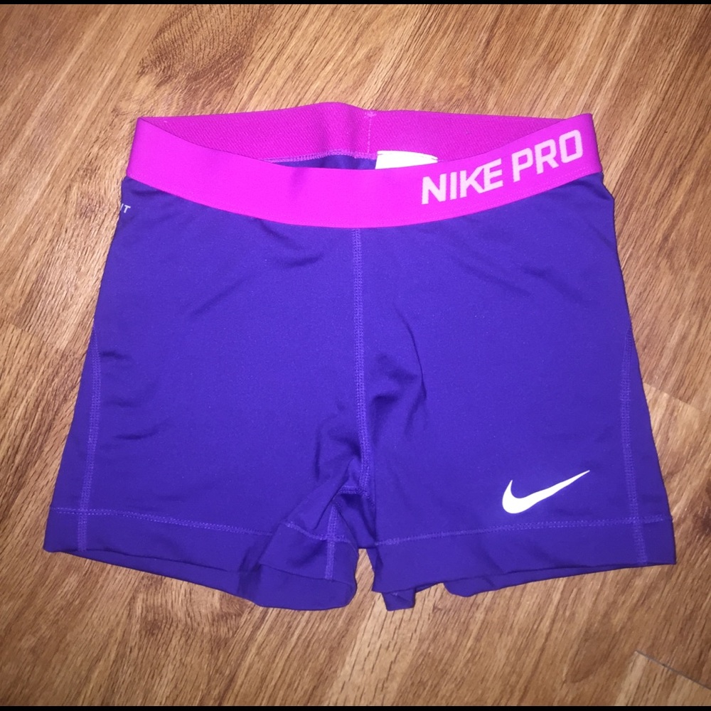 Purple and pink nike pros