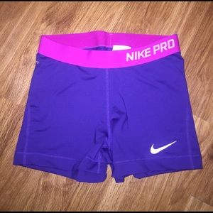 Purple and pink nike pros
