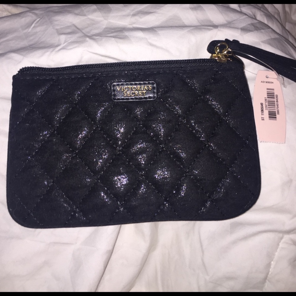 VS black wristlet with gold vs charm