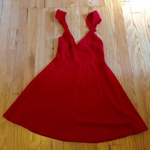 Red dress with strap detail and deeper back