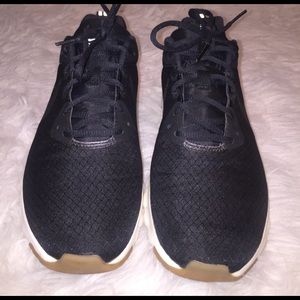 Black, white and tan Nike Air Max Motion