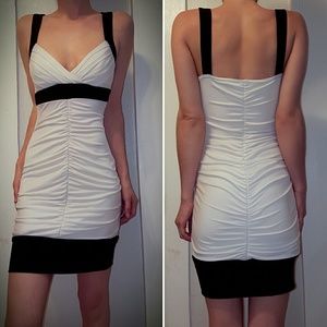 Black and white ruched body con mini dress