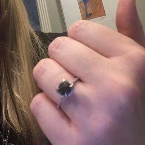 Black diamond ring with diamond accents